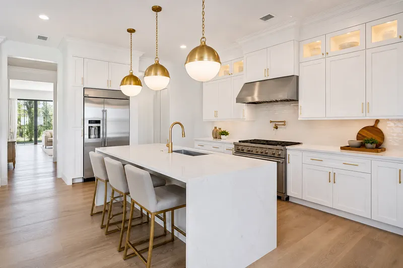 Finished white kitchen with a quartz island