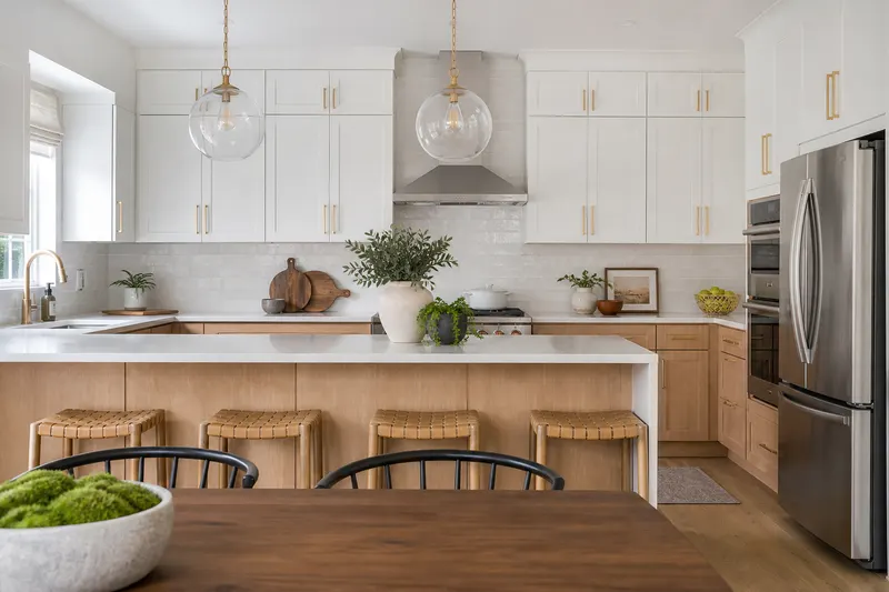 Finished two-tone kitchen with a wood island