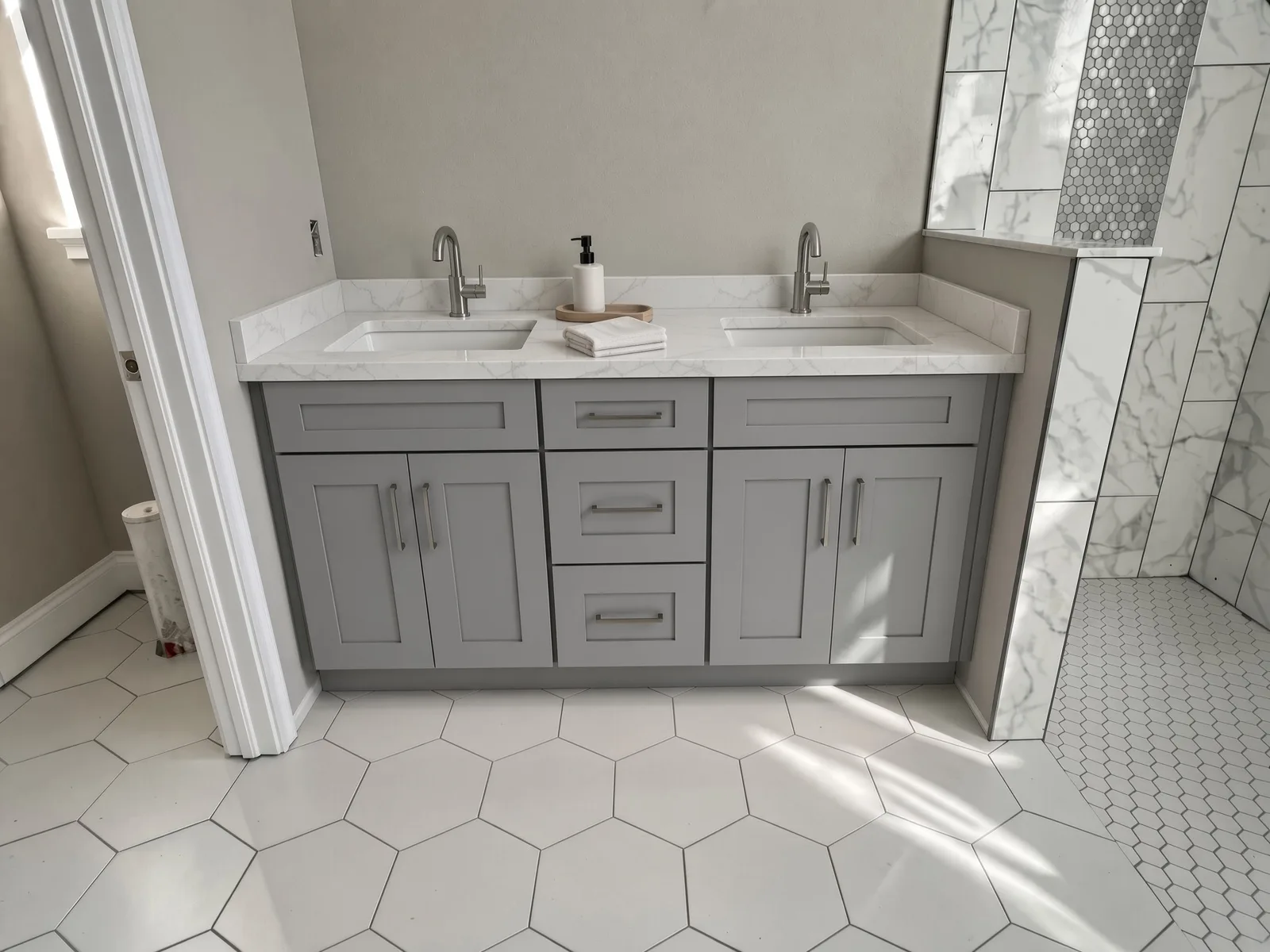 Gray shaker cabinets over hex tile in a Tampa Bay bathroom