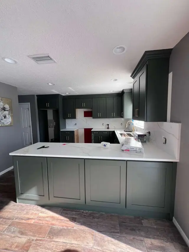 Kitchen with a green island