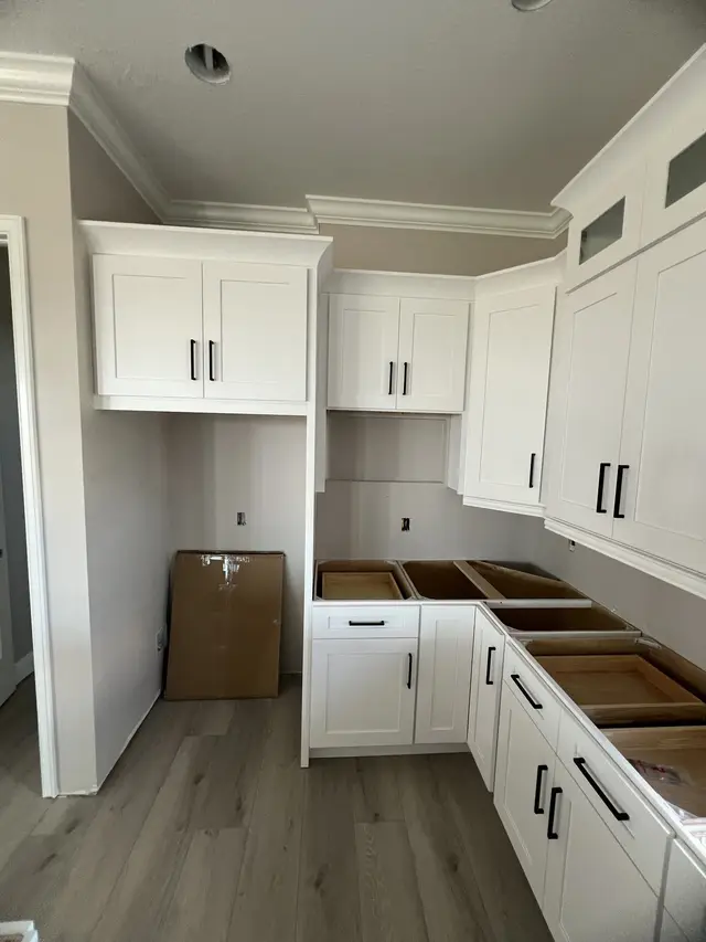 White kitchen with crown