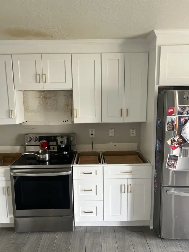 White kitchen at the range