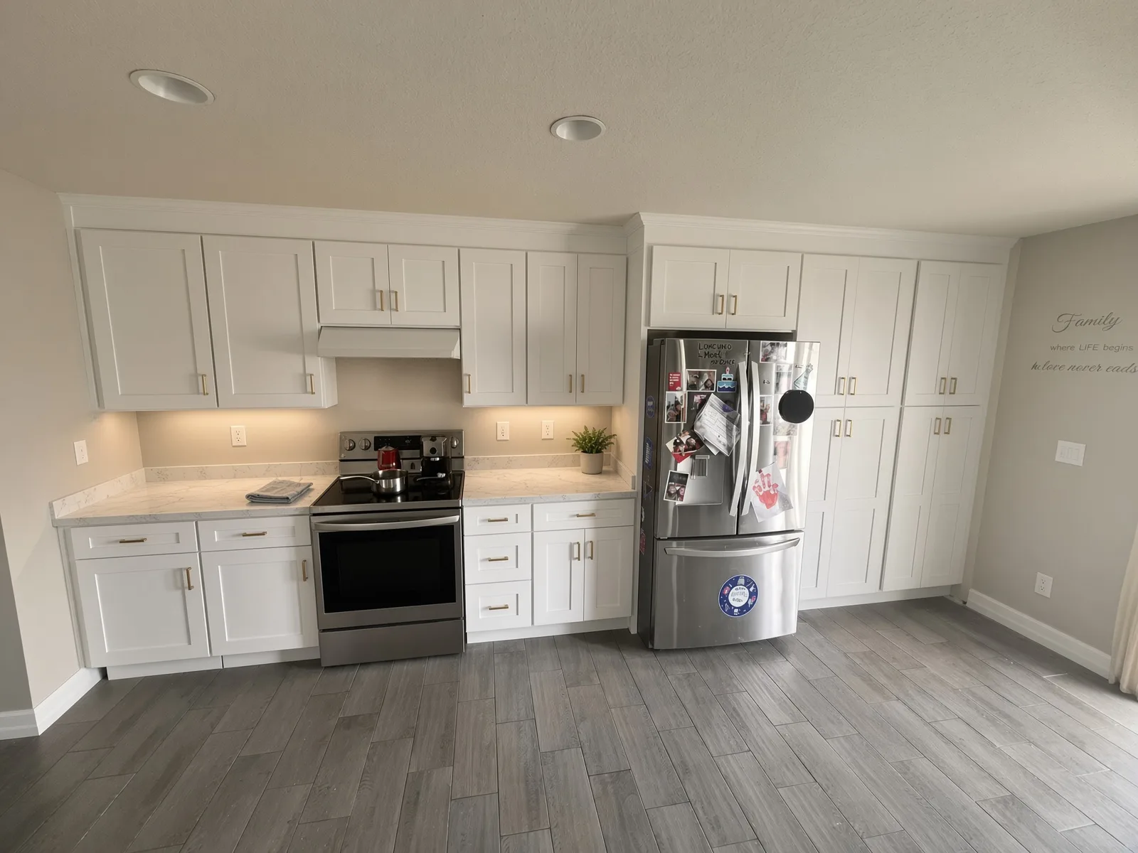 White kitchen cabinets at the range installed in a Tampa Bay home