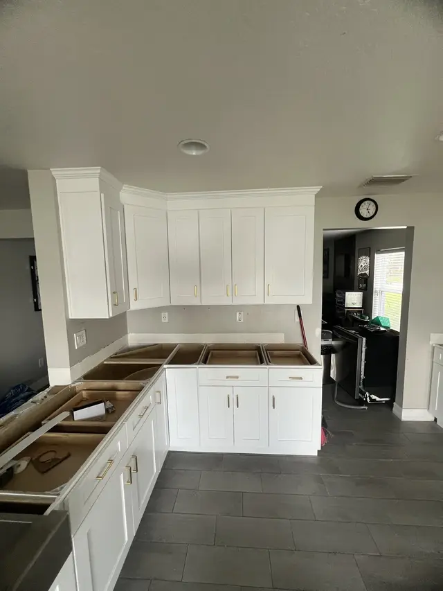 L-shaped white kitchen