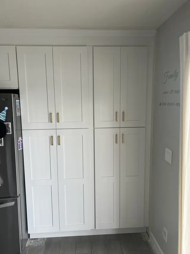 Floor-to-ceiling white pantry cabinets
