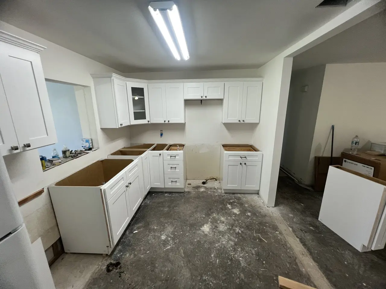 U-shaped kitchen cabinets installed and awaiting countertops in Tampa
